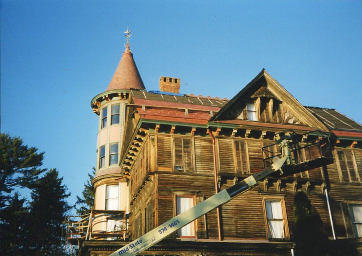 AFTER INITIAL WORK ON THE TOWER, REPAIR AND PAINTING OF THE BODY OF THE MANSION BEGINS