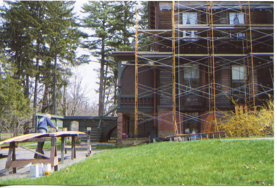 AFTER INITIAL WORK ON THE TOWER, REPAIR AND PAINTING OF THE BODY OF THE MANSION BEGINS